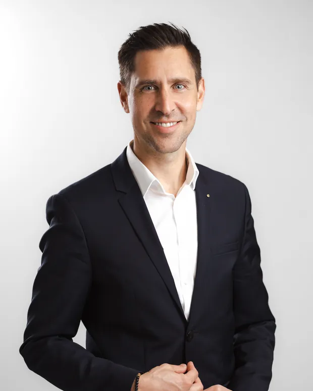 Studio portrait of Bernhard Brandl in a navy suit.